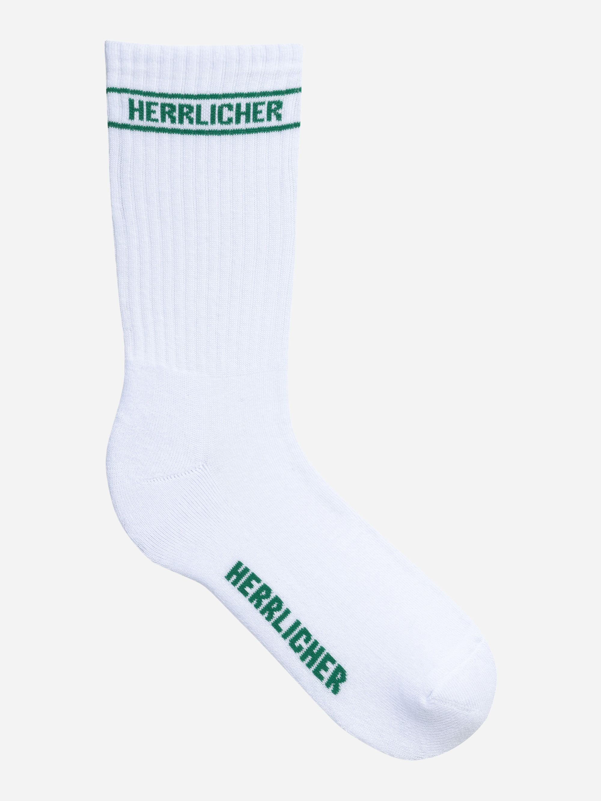 Eine einzelne weiße Socke mit grünen Streifen am oberen Ende und dem Wort HERRLICHER in grüner Schrift auf dem Bündchen und an der Sohle.