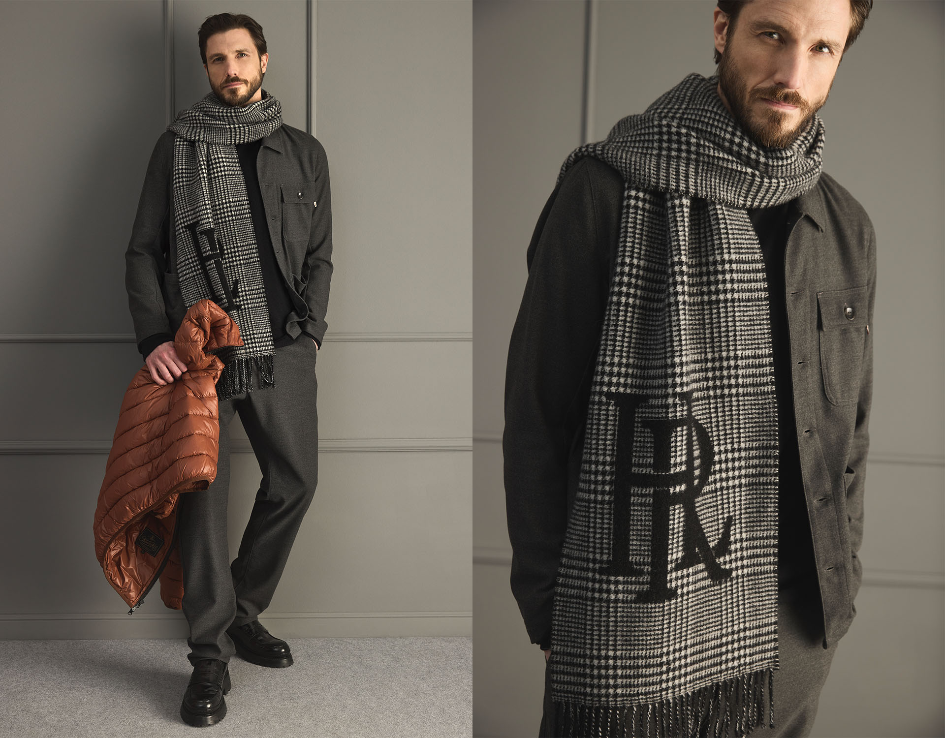 Ein Mann, der ein dunkles Hemd, eine graue Hose und einen großen schwarz-weiß karierten Schal mit den Buchstaben LR trägt, hält eine rostfarbene Steppjacke. Der Hintergrund ist eine schlichte, graue Verkleidung.